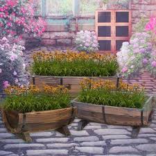 August Grove Wentzel Cedar Wheelbarrow Planter Wayfair Barrel Garden Planters Garden Planters Wheelbarrow Planter