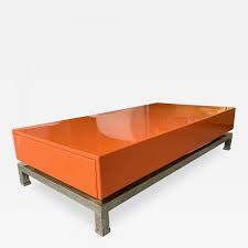 Lofted on airy steel legs, there is enough room to stow anything from magazines and remotes to pillows and throws. Guy Lefevre Lacquered Coffee Table And Brass By Guy Lefevre France 1970s