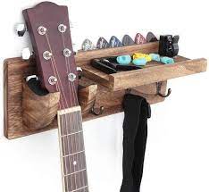 Adding it to your wall decor is also a fun way to. Guitar Holder Wall Mount Bracket Guitar Wall Hanger Wood Etsy In 2021 Guitar Wall Hanger Wood Guitar Stand Guitar Wall