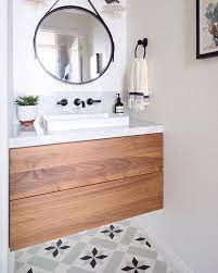 With a marble top, open shelf design and matte black base, this vanity is worth splurging on and will elevate your powder room. What S Not To Like In This Powder Bath Featuring The In Stock Star Pattern Repost Marissa Cramer T Small Bathroom Vanities Powder Room Small Powder Room