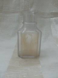 This vintage medicine bottle has water marks and slight discoloration on the inside. Antiques Art Vintage