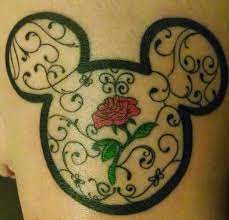 Traditional outline mouse looking out of huge rose bud tattoo design. 30 Awesome Mickey Mouse Tattoos