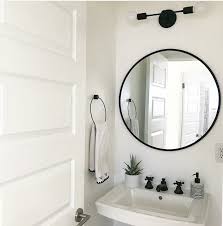 Black Modern Two Light Wall Sconce In A Black And White Bathroom That Has A Black Mirror An Black Bathroom Mirrors Small Bathroom Mirrors Round Mirror Bathroom