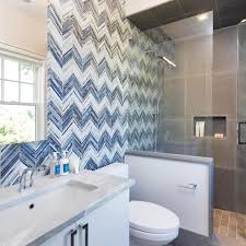 Designers are loving large tiles or slabs, which reduce grout lines and can give a more streamlined look. Photos Hgtv