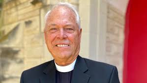 Larry Adams-Thompson helping Afghan friend