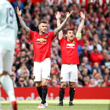 A premier league match between manchester united and liverpool has been delayed after fans dramatically broke into old trafford and invaded the pitch in a protest against the glazer family. Gary Neville Makes David Beckham Joke After Manchester United Treble Reunion Game Manchester Evening News