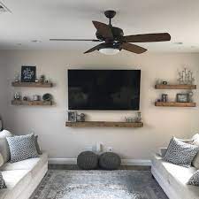 Put your woodworking skills to practice by building rows of shelves across a wall. Ready To Ship Floating Shelf Farmhouse Shelves Shelf Etsy Floating Shelves Living Room Wall Shelves Living Room Gallery Wall Shelves