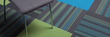 Changes in carpet tile colours or pattern can be used for wayfinding, such as indicating where people should queue at ticket windows. Accelerate Commercial Carpet Tiles Collaborative Office Interiors