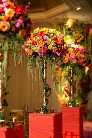 Multicolored Flower Centerpiece Colorful Fusion Wedding Filled With Thousands Of Yell Orange Wedding Flowers Floral Arrangements Wedding Wedding Arrangements