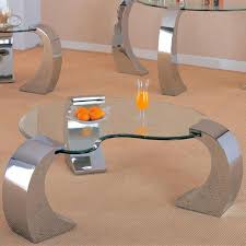 The guitar pick shaped table tops are mdf with a walnut oak veneer and paired with matte black metal legs. Modern Metallic Coffee Tables