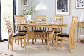 Glass dining tables a modern glass dining table helps make a smaller dining room feel bigger and is a great solution for highlighting a statement area rug placed beneath the table. Oval Dining Sets Dining Tables Chairs Furniture And Choice