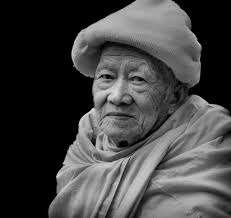 Man in moment of inner peace in Kathmandu market