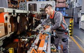 Prior to its introduction, workers would assemble a product—or a large part of it—in place, often with one worker completing. Audi Workers Are Testing Exoskeletons To Reduce Strain On Assembly Line Slashgear