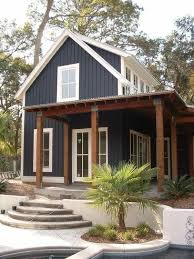 Love The Dark Blue Color With Bright Trim And The Dark Natural Wood It S A Great Combin Modern Farmhouse Exterior House Designs Exterior Exterior House Colors