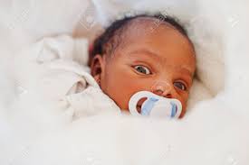 While of course any adoption is a blessing, there are also issues that will arise that parents must be ready to address. Small Tiny Newborn African American Baby Laying On The Bed Stock Photo Picture And Royalty Free Image Image 82159235