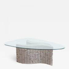 Inspired by the sensual movement of ocean swells, the fin shaped legs appear to give it an. Ivory Fossil Stone Sculptural Coffee Table With Biomorphic Glass Top Circa 1980