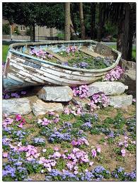 See more coastal decorated terra cotta pots. 52 Boat Garden Planter Ideas Garden Garden Planters Outdoor Gardens