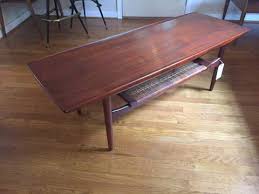 Solid walnut and walnut veneer construction, stretchers Danish Modern Walnut Coffee Table With Rattan Shelf Epoch