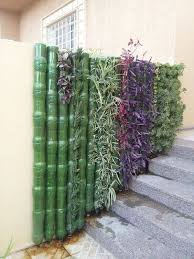 This design utilizes recycled plastic beverage bottles. 29 Clever Plastic Bottle Vertical Garden Ideas Farmfoodfamily