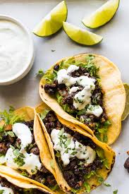 Cut the corn kernels off of the cobs and put them in a serving bowl along with the diced peppers. Black Bean Tacos Isabel Eats