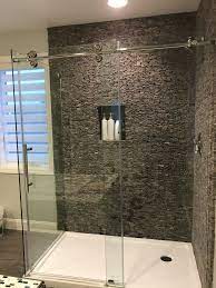 Explore sinks, bathtubs, and showers, creative tile designs, and a variety of counter and flooring ideas. Grey Standing Mosaic Tile Pebble Tile Tile Bathroom Master Bathroom Shower