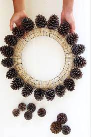 Beautiful Fast Easy Diy Pinecone Wreath Improved Version Christmas Pine Cones Pinecone Wreath Christmas Decorations Centerpiece