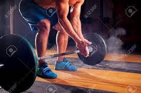 Young Sporty Man With Naked Torso Clapping Hands With Chalk Powder,  Preparing For Weightlifting Training. Cross Fit, Power Lifting Equipment.  Sports, Fitness - Healthy Lifestyle Concept. Stock Photo, Picture and  Royalty Free