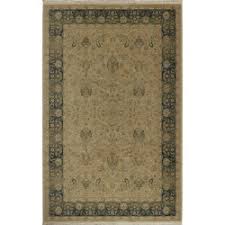 The rug features a dense and vibrant floral design in red, blue, black, green, pink, white, and tan on an ivory field, with sickle leaves and an elaborate border having a vibrant ruby red accent. Persian Garden 700 728