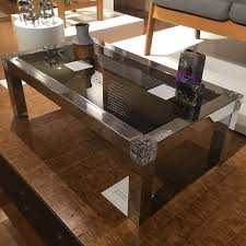 A classic contemporary designed glass coffee table with a featured curved base, this exquisite piece of smoked glass furniture would fit into any modern. Smoked Glass And Chrome Coffee Table Cb2
