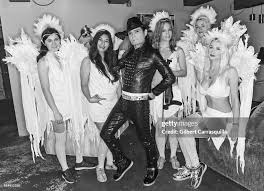 Actor/singer Corey Feldman poses backstage with drummer Marisa Testa,...  News Photo