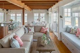 Many coastal house plans draw from the cottage style, which can be smaller in size to create a cozy feeling for its owners. Breezy Coastal Beach Cottage With Open Floor Plan Martha S Vineyard Interior Design Hgtv