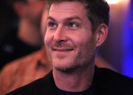 Jory Brigham of California wins "Framework" season 1 over Akron's Freddy  Hill and Rocky River's Jason Radcliffe; crowd watches at Lakewood bar