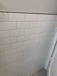 And, in this next image, notice how the concrete tile has been pulled up one wall and contrasts beautifully with the other white subway tile wall. Matte Subway Tile Matte Subway Tile White Subway Tile Bathroom Wainscoting Bathroom
