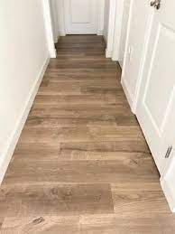 Pergo Timbercraft Wetprotect Wheaton Oak 12 Mm Thick Waterproof Wood Plank 7 48 In W X 54 33 In L Laminate Flooring 16 93 Sq Ft Lowes Com Flooring Waterproof Laminate Flooring Oak Laminate Flooring