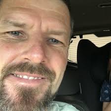 What are the possible causes and solutions for water leakage into the  passenger footwell of a Ford Falcon?