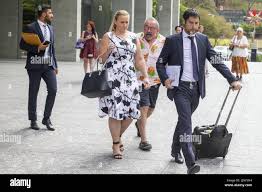 Logan councillor Stacey Lee McIntosh is seen leaving the Brisbane District  Court while being hounded by Dan Ling, a disgruntled resident of her  electorate, in Brisbane, Friday, March 8, 2018. The Councillor