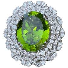 Maybe you would like to learn more about one of these? August Birthstone 16 Carat Large Vivid Peridot And Diamond 18 Karat Gold Ring For Sale At 1stdibs