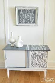 We upcycled a garage utility cabinet to provide the wood for encasing the cabinet. Mid Century Modern Record Cabinet Makeover Interior Frugalista