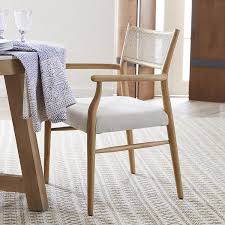 This Simply Sophisticated Oak Chair Is Sure To Elevate Your Dining Room Featuring An Angled Rattan Back S In 2020 Oak Chair Luxury Dining Room White Leather Armchair