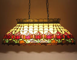 Worth noting, is that darker glass won't diffuse light as readily as a clear glass, rendering these pendants best for spaces that might already have an efficient overhead light. China Customized Tiffany Tulip Billiard Lights Stained Glass Hanging Lamp China Tiffany Billiard Tiffany Floor Lamp