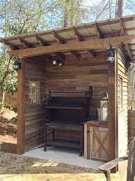 A covered area does not have to be an outdoor kitchen. Hugedomains Com Bbq Shed Bbq Shelter Grill Gazebo