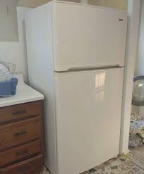 Kenmore counter depth Refrigerator with top Freezer. Has an ice maker.  Color: Almond. We recently bought this home & are upgrading appliances.  Cash only.