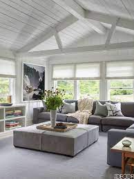 Two upholstered armchairs are placed adjacent to the sectional for intimate conversations. 30 Minimalist Living Rooms Minimalist Furniture Ideas For Living Rooms