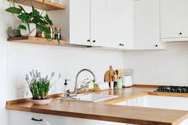 The bare wooden rack countertop brings all the style in this kitchen coupled with a stainless steel faucet sink and fixtures. How To Decorate Kitchen Countertops 2021 Marble Com
