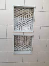When it comes to shower tiling, you may never need to worry about outside tile corner trims for your tile work unless you are installing a tiled shower niche or tiling a pony wall or shower bench. Double Niche With Bianco Polished Hexagon Mosaics Marble Tiles From Home Depot Marble Pencil Trimming I Tile Shower Niche Tile Bathroom Master Bathroom Shower