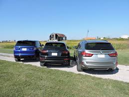 Bmw X5 M Vs Porsche Cayenne Turbo S Vs Range Rover Sport Svr Autoguide Com