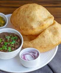 It is a combination of fried bread called bhatura and spicy chickpeas (chole). New Delhi Chole Bhature Home Delivery Order Online Gill Road Gill Road Ludhiana