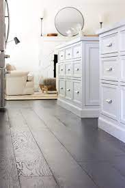 Dark wood floors really make white cabinets stand out for all there are worth. White Kitchen With Dark Wood Floors Would We Do It Again
