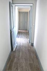 Love These Greyish Brown Floors Plus Light Blue Gray Doors Trim With White Or Light Gray Walls Light Grey Walls Brown Floors Grey Doors