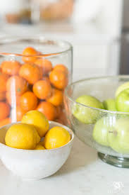 Gilded wine grape themed kitchen canister set. Kitchen Island Decor 6 Easy Styling Tips Kelley Nan Citrus Kitchen Decor Kitchen Island Decor Citrus Kitchen